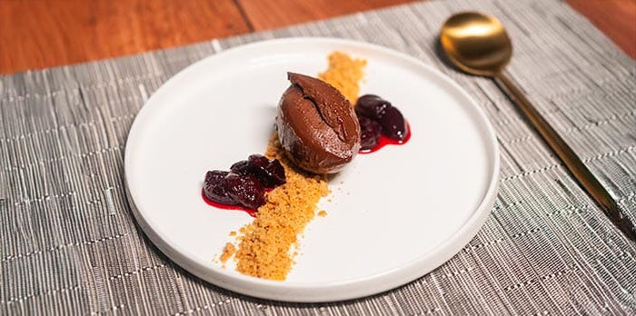 Chocolate Crémeux with Cherry Compote and Crumble Sand