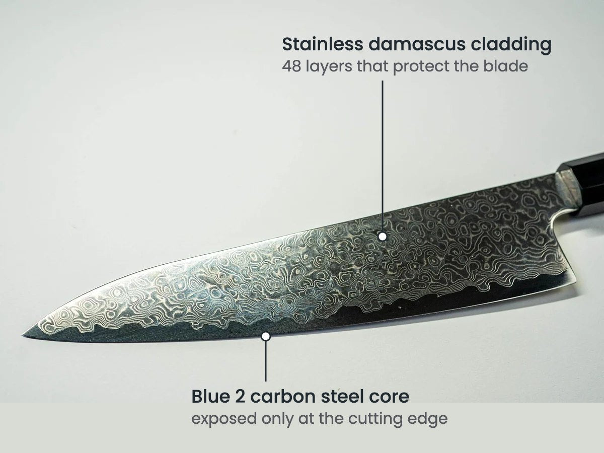 Season Blue 2 Chef's Knife: stainless damascus cladding and the Blue 2 carbon steel core at the cutting edge